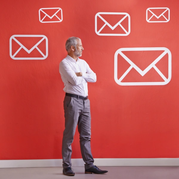 Professional man standing confidently on a clean background, representing innovation and leadership in AI