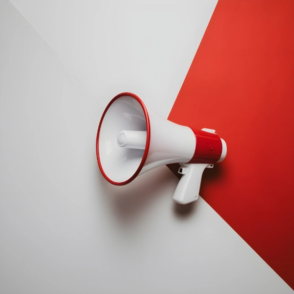 Professional microphone on a white surface representing sound, recording, and intelligent speech systems.