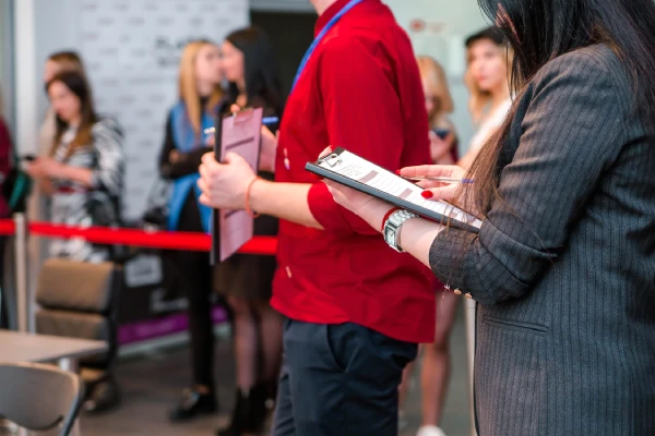 Woman holding a tablet and reviewing digital content